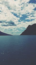 Scenic view of sea against cloudy sky