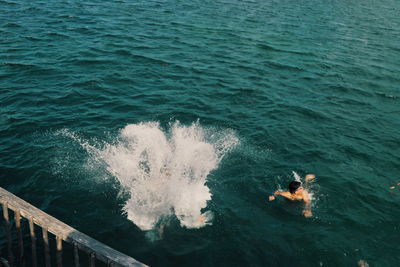 High angle view of man swimming in sea