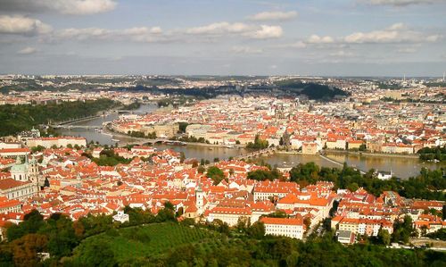 Cityscape against cloudy sky