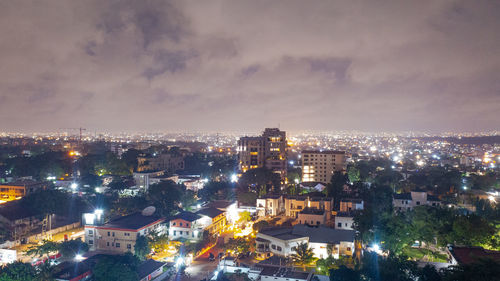 High angle view of illuminated buildings in city