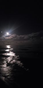 Scenic view of sea against sky at night