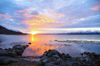 Scenic view of sea against sky at sunset