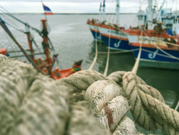 Close-up of fishing boats moored at harbor