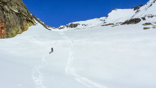 Scenic view of snow covered mountain against sky