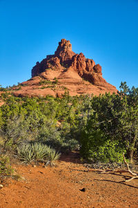 Scenic view of mountain against clear blue sky