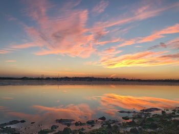 Scenic view of lake against sky during sunset