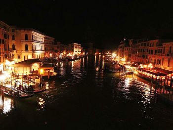 View of canal in city at night