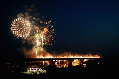 Firework display at night