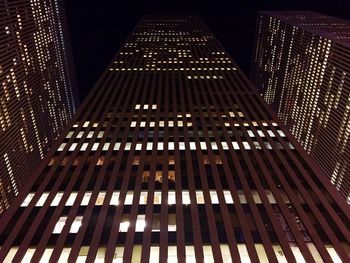 Low angle view of illuminated building at night