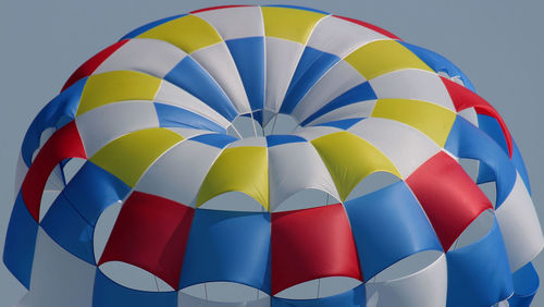 Low angle view of colorful hot air balloon against clear sky