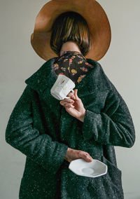 Woman holding coffee cup