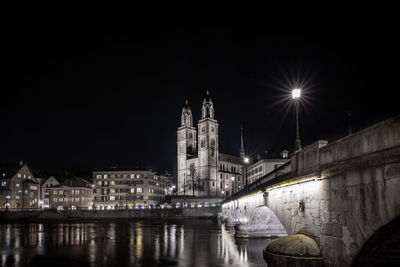 Illuminated buildings in city at night