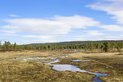 View of landscape against cloudy sky