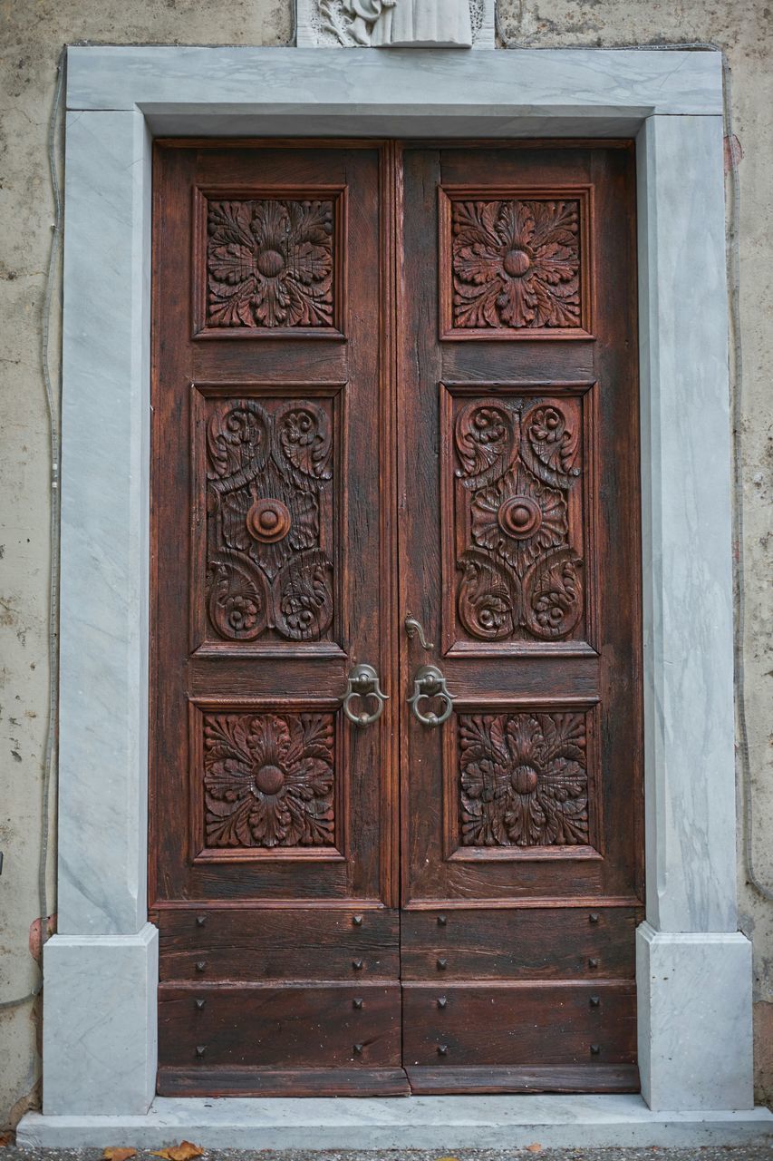 door, closed, building exterior, built structure, architecture, entrance, safety, protection, wood - material, red, wall - building feature, security, pattern, window, wooden, ornate, house, day, old, outdoors