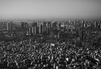 High angle view of modern buildings in city against sky