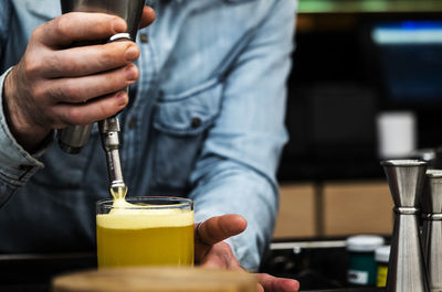 Close-up of man holding drink