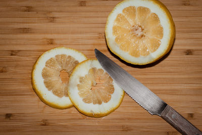 High angle view of orange slices on cutting board