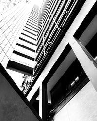 Low angle view of modern buildings against sky in city