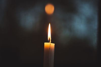 Close-up of illuminated candle