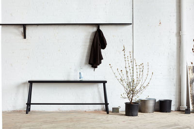 Bench, shelf, coatrack in industrial space