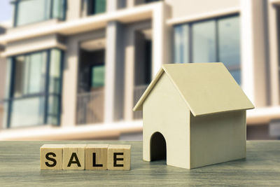 Information sign on table by house in building