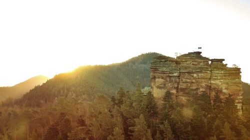 Old building on mountain against clear sky