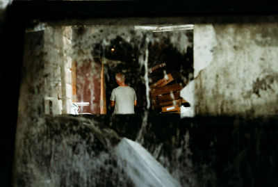 High angle view of woman standing in cave