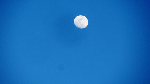 Low angle view of moon in sky