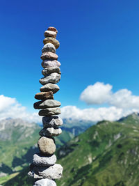 Stack of stones against blue sky 