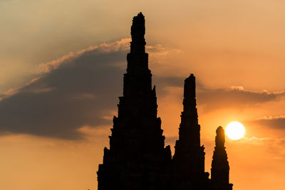 Low angle view of silhouette temple against sky during sunset