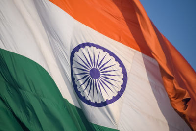 India flag flying high at connaught place with pride in blue sky, india flag fluttering, indian flag