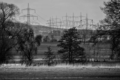 Scenic view of electrical towers in field