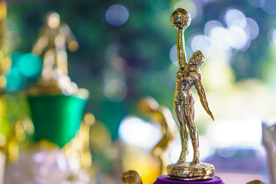 Close up of golden figurine