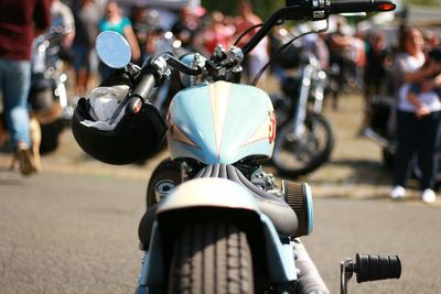 Close-up of motorcycle on road