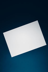 High angle view of empty paper against black background