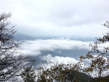 Scenic view of snow covered mountains against sky