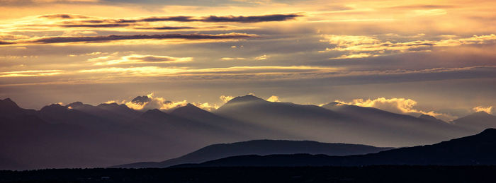 Scenic view of dramatic sky during sunset