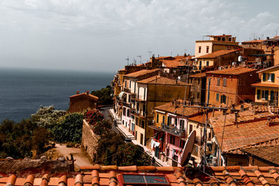 High angle view of houses by sea