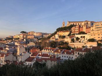 Buildings in town against sky