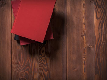 High angle view of paper on wooden floor