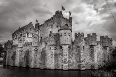 Low angle view of historic building against cloudy sky