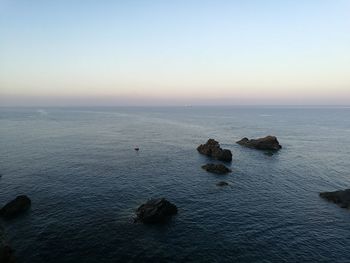 Scenic view of sea against sky at sunset