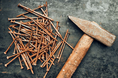 Hammer and nails on steel surface. tools for maintenance. hardware tools to fix. tech background