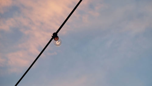 Low angle view of street light against sky