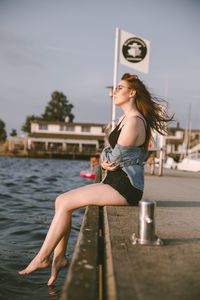 Woman sitting in water