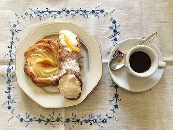 Directly above shot of cappuccino served on table