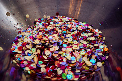 Colorful sequins in container