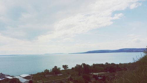 Scenic view of sea against cloudy sky