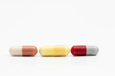 Close-up of capsules on white background