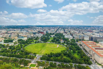 High angle view of trees and buildings against sky